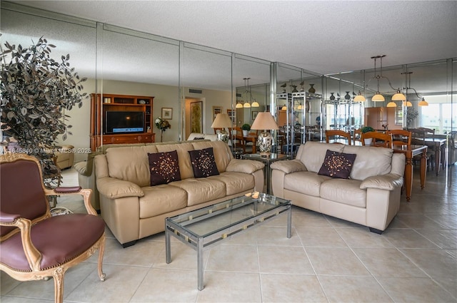 tiled living room with a textured ceiling