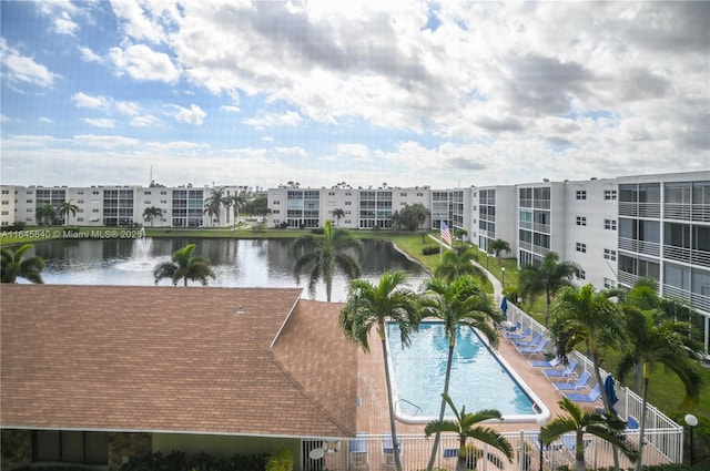 view of pool featuring a water view