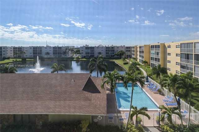 view of swimming pool with a water view