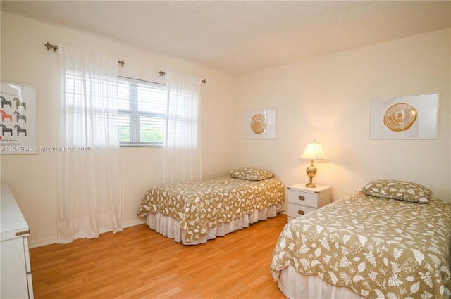 bedroom with light hardwood / wood-style flooring