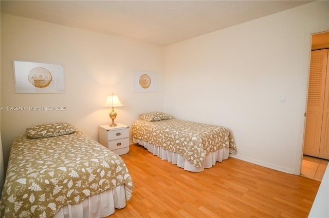 bedroom with light hardwood / wood-style flooring