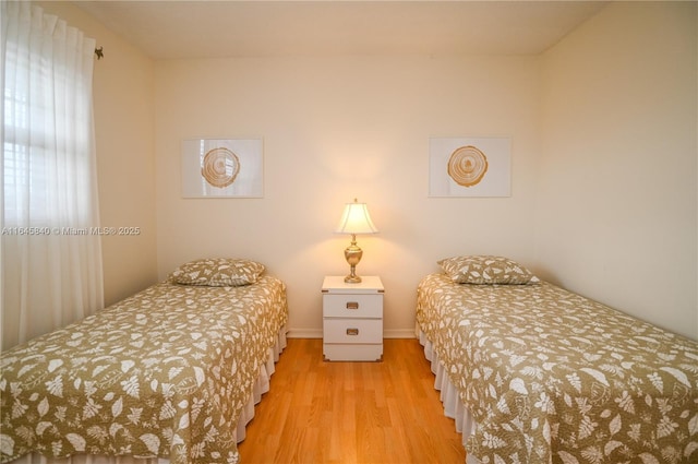 bedroom with light hardwood / wood-style flooring