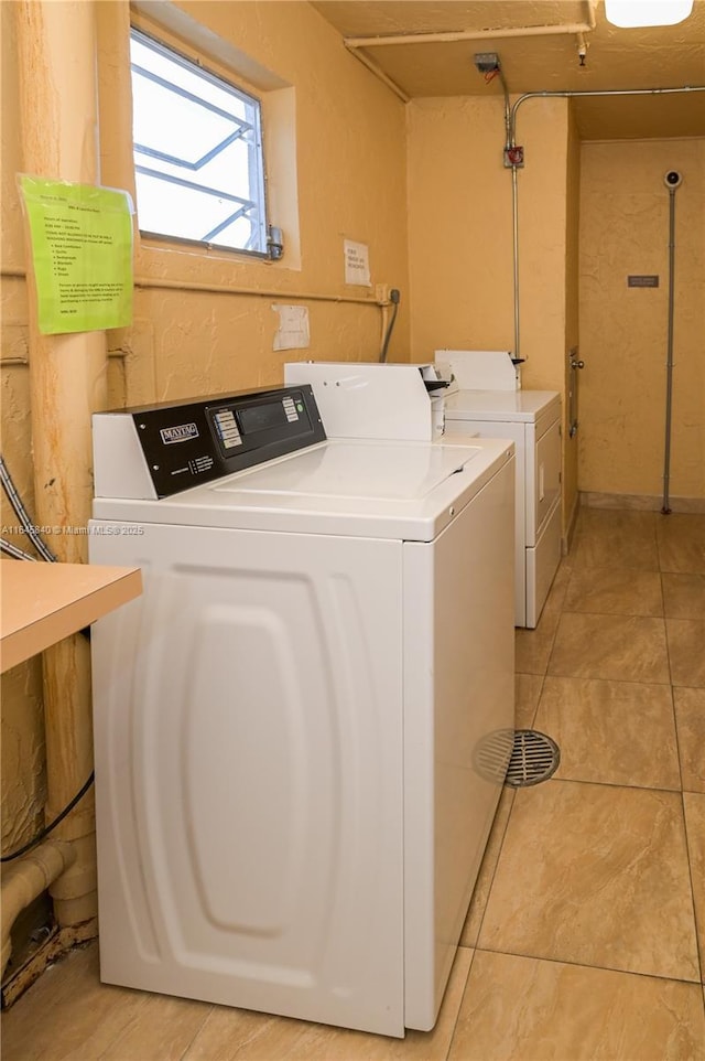 clothes washing area featuring washing machine and dryer