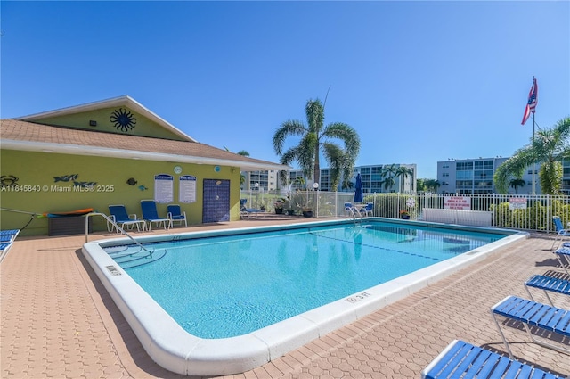 view of swimming pool with a patio