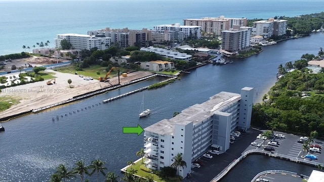 birds eye view of property featuring a water view