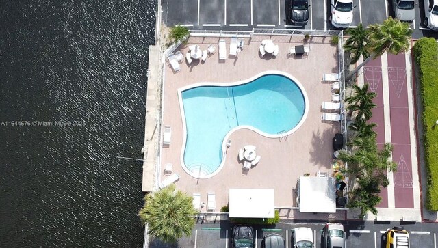 birds eye view of property with a water view