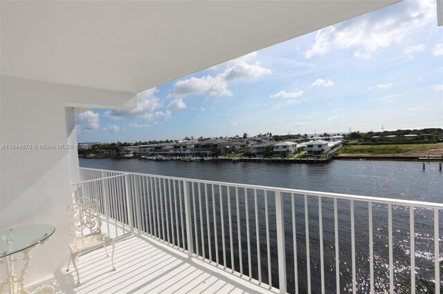 balcony featuring a water view