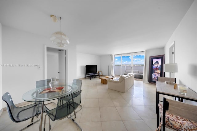 living room featuring floor to ceiling windows and light tile patterned floors