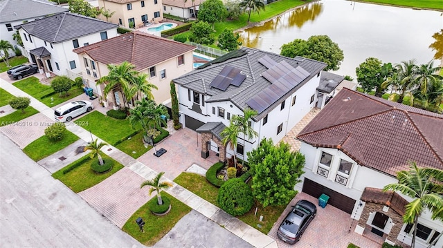 bird's eye view featuring a residential view and a water view