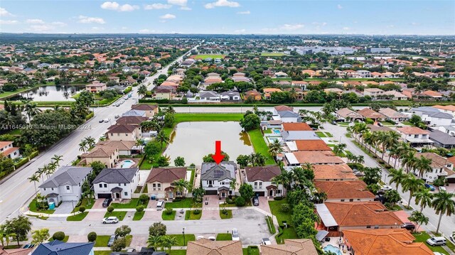 birds eye view of property featuring a water view