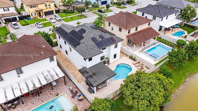 aerial view featuring a water view and a residential view