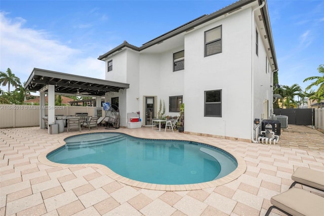 view of swimming pool with a fenced in pool, cooling unit, a patio area, and a fenced backyard