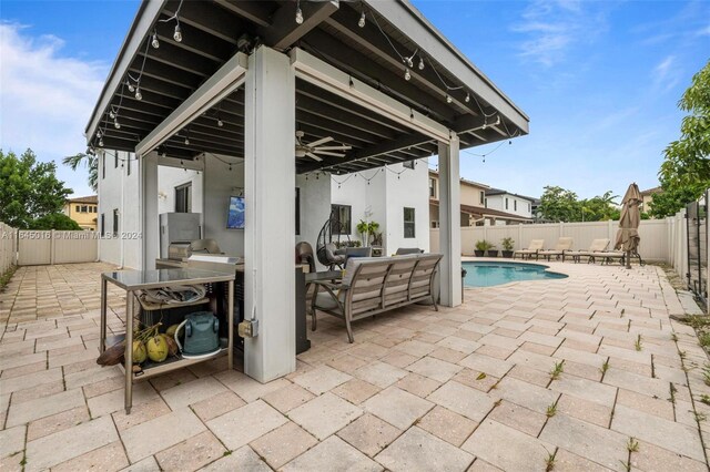 view of patio with a fenced in pool