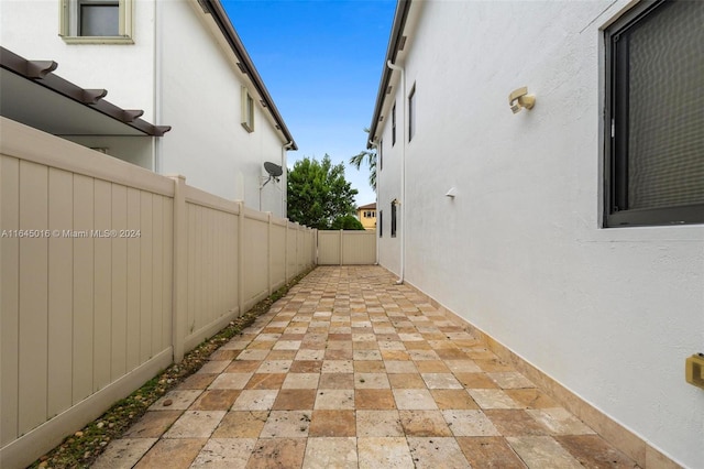 view of side of home with a patio