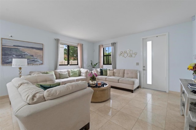 living room with light tile patterned flooring