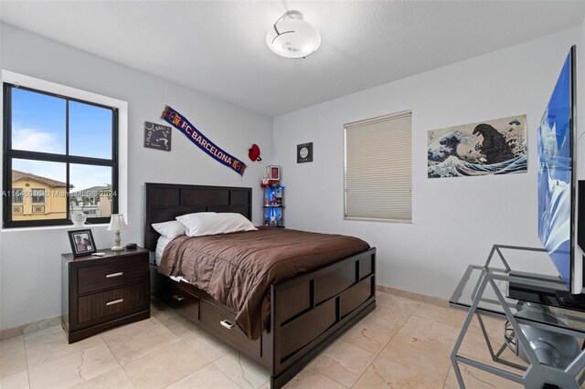 bedroom featuring light tile patterned flooring