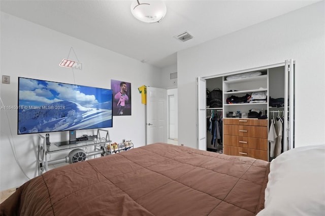 bedroom featuring a closet and visible vents