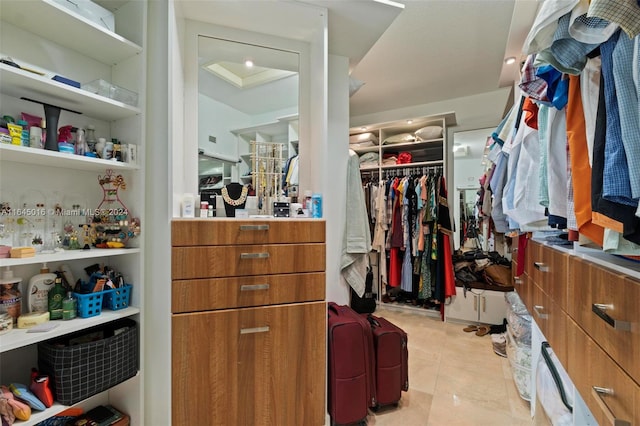 spacious closet with light tile patterned flooring