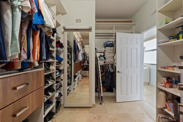 walk in closet featuring light tile patterned floors