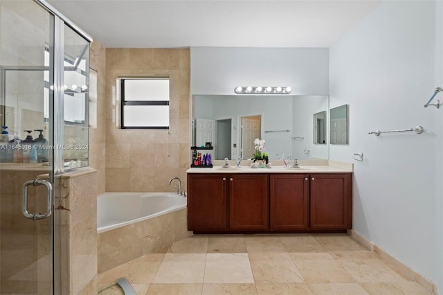 full bathroom with a garden tub, double vanity, a sink, and a shower stall