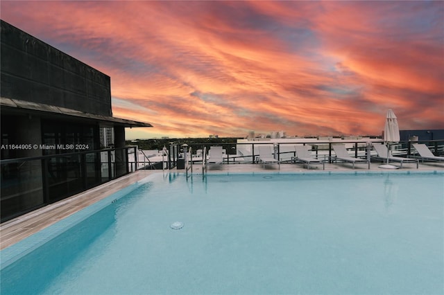 pool at dusk with a water view