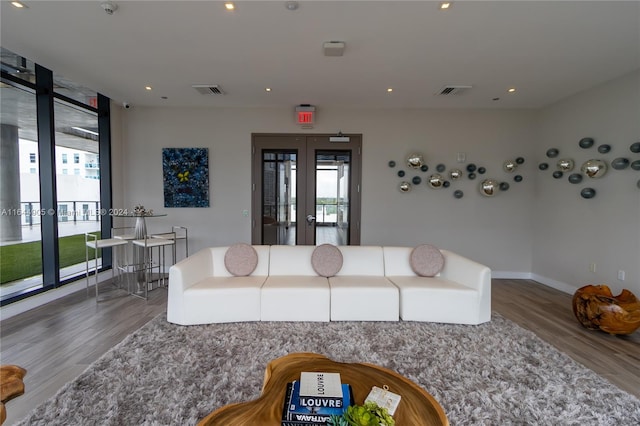 living room featuring french doors and wood-type flooring