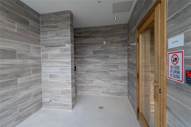 bathroom with a tile shower