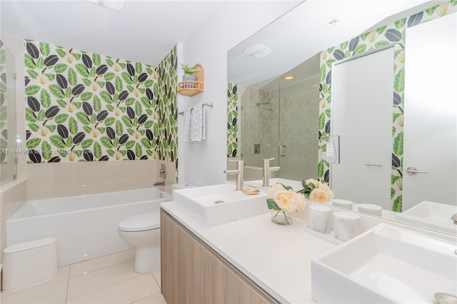 full bathroom featuring toilet, shower with separate bathtub, vanity, and tile patterned flooring