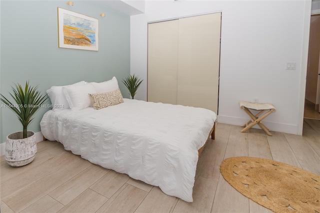 bedroom featuring a closet and hardwood / wood-style flooring