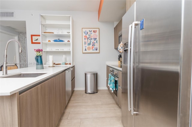 kitchen with sink and stainless steel appliances