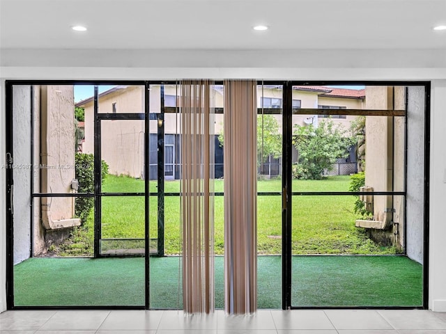 doorway featuring tile patterned flooring