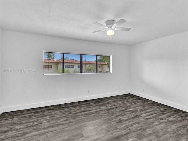 empty room with hardwood / wood-style floors and ceiling fan