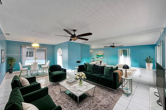 living room with light tile patterned floors and ceiling fan