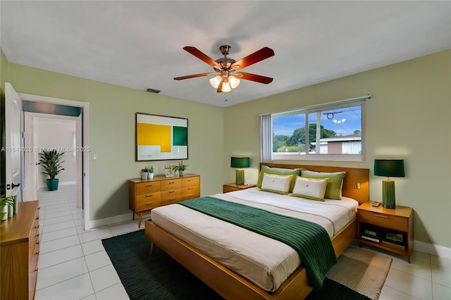 tiled bedroom with ceiling fan