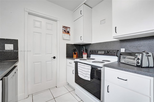 kitchen with white range with electric stovetop, white cabinetry, light tile patterned floors, and tasteful backsplash