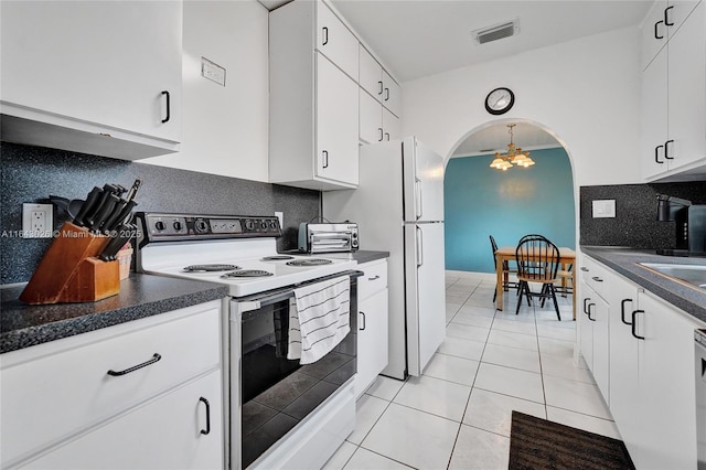 kitchen with white cabinetry, hanging light fixtures, white appliances, decorative backsplash, and light tile patterned floors