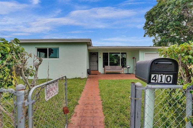 ranch-style house with a front lawn