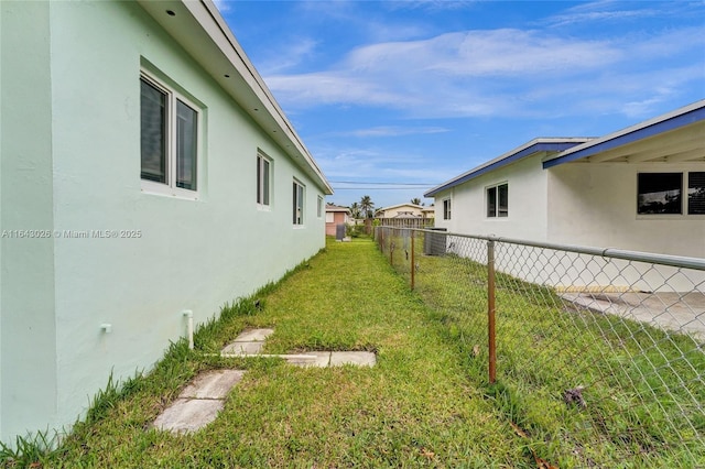 view of yard with central AC unit