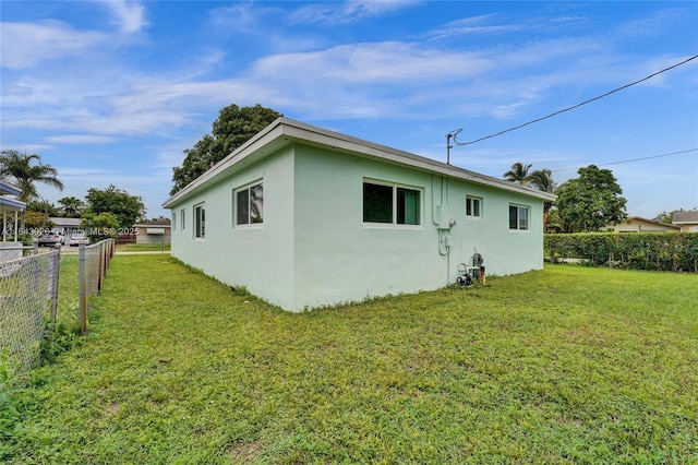 view of home's exterior featuring a lawn