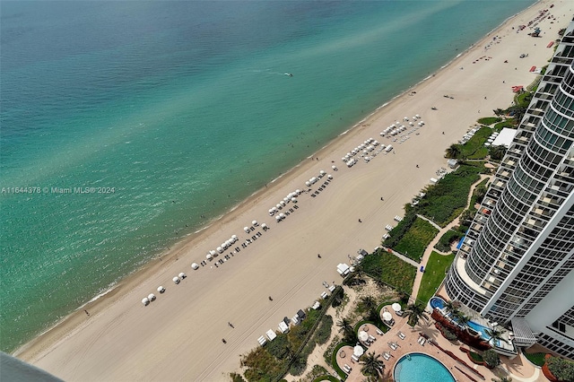 aerial view with a view of the beach and a water view