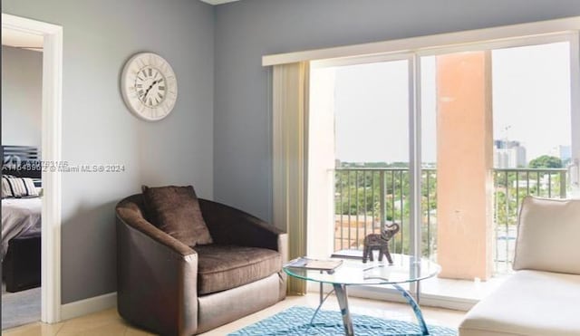 sitting room featuring light tile patterned flooring