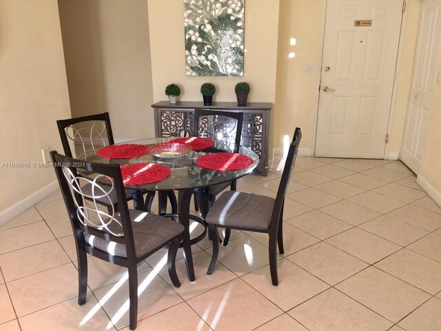 dining space with light tile patterned flooring