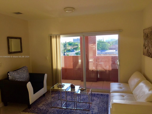 living area with tile patterned flooring and visible vents