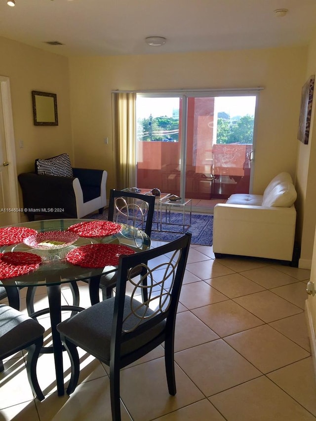 tiled dining area with visible vents