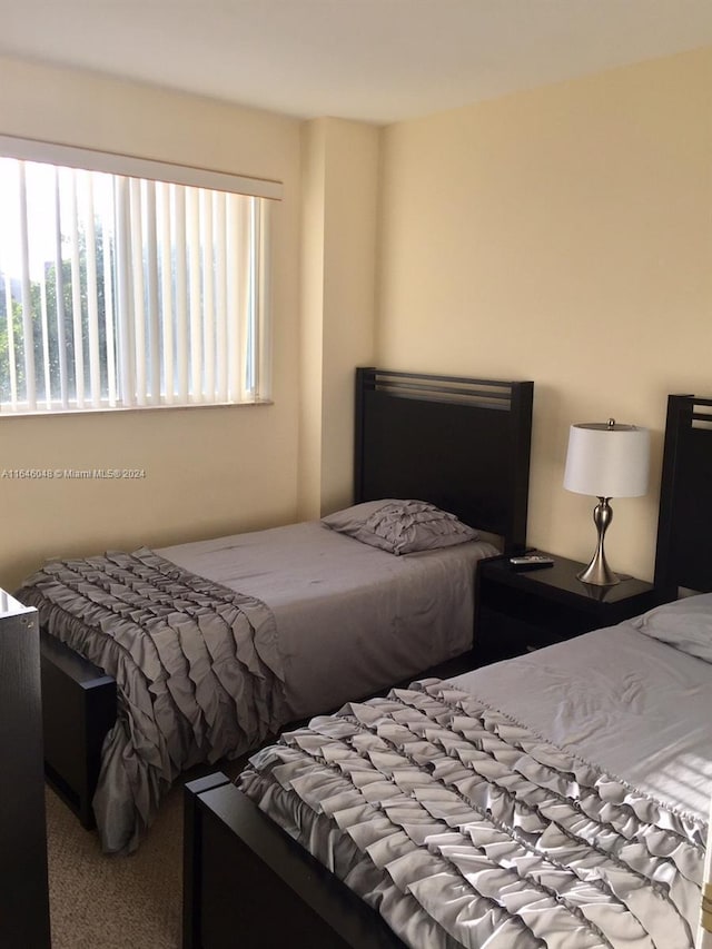 bedroom with light carpet