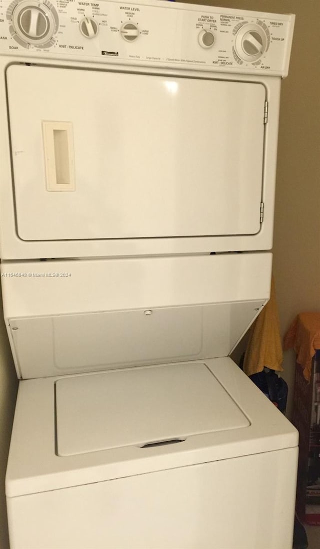 laundry room with laundry area and stacked washing maching and dryer