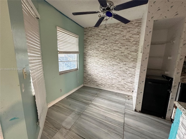 interior space featuring ceiling fan and light tile patterned flooring