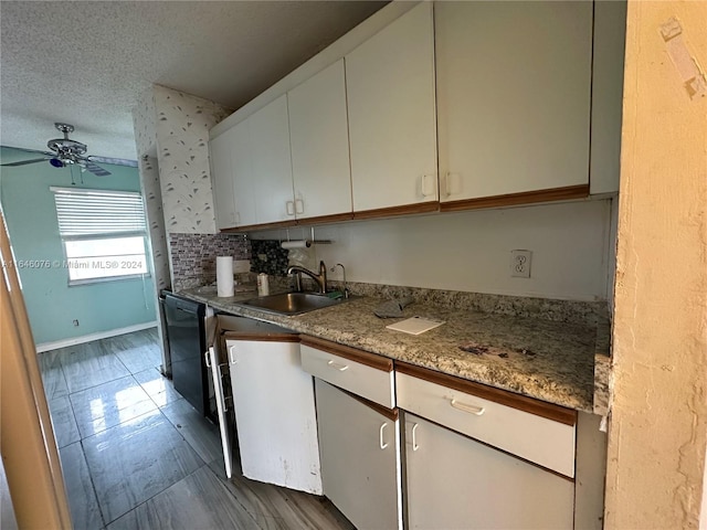 kitchen featuring backsplash, sink, tile patterned floors, a textured ceiling, and ceiling fan