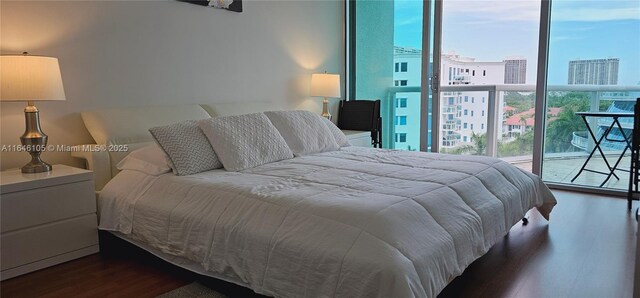 3131 NE 188th St Unit 1-810, Aventura, FL 33180 - bedroom with a view of city, expansive windows, and wood finished floors