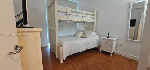 bedroom featuring dark hardwood / wood-style floors